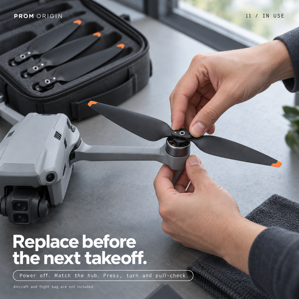Person installing a replacement propeller on a powered-off Air 3-series drone; aircraft and case not included.