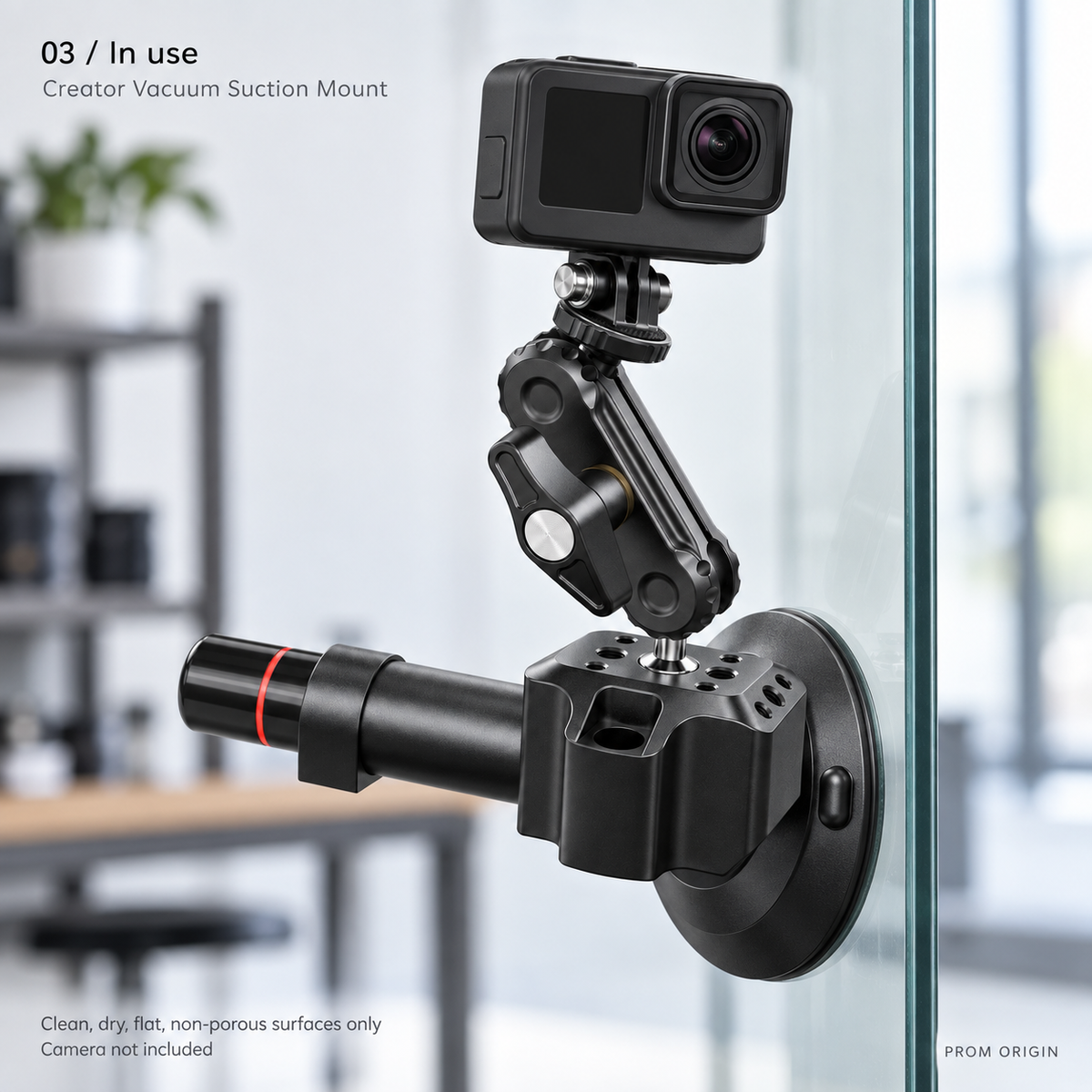 Vacuum mount attached to clean indoor glass with an unbranded action camera; camera not included.