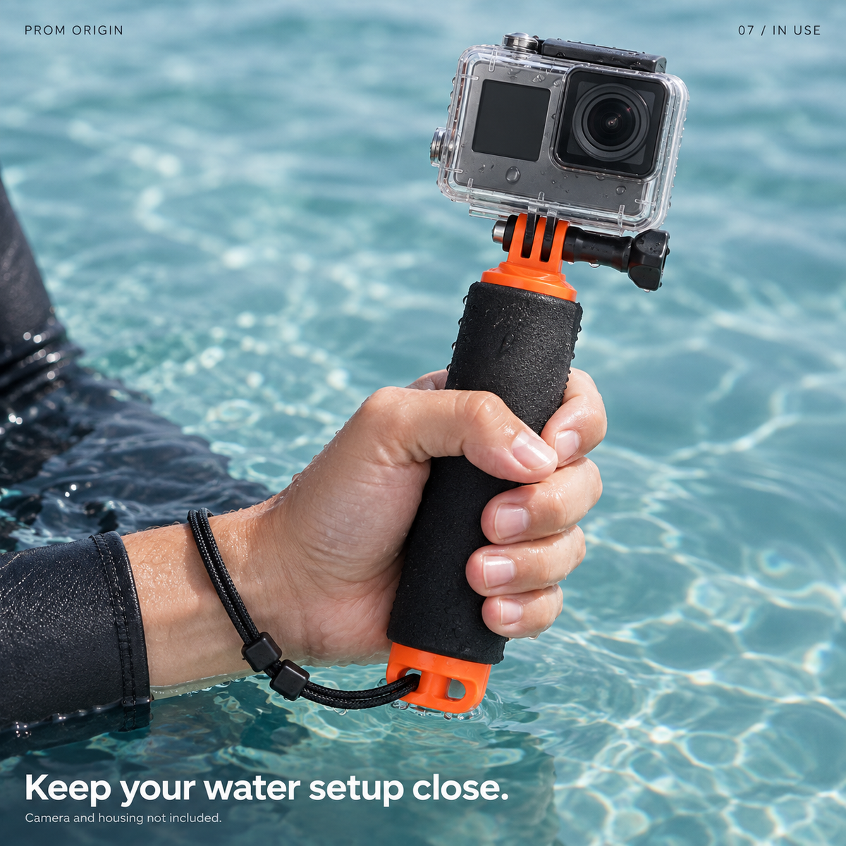 360 Dive Creator Kit held at the water surface; camera and housing not included